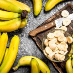 how to freeze bananas for smoothies with sliced bananas on tray