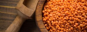 Whole red lentils in a bowl