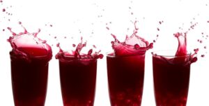 MetaBoost power shots with raspberry juice in glasses